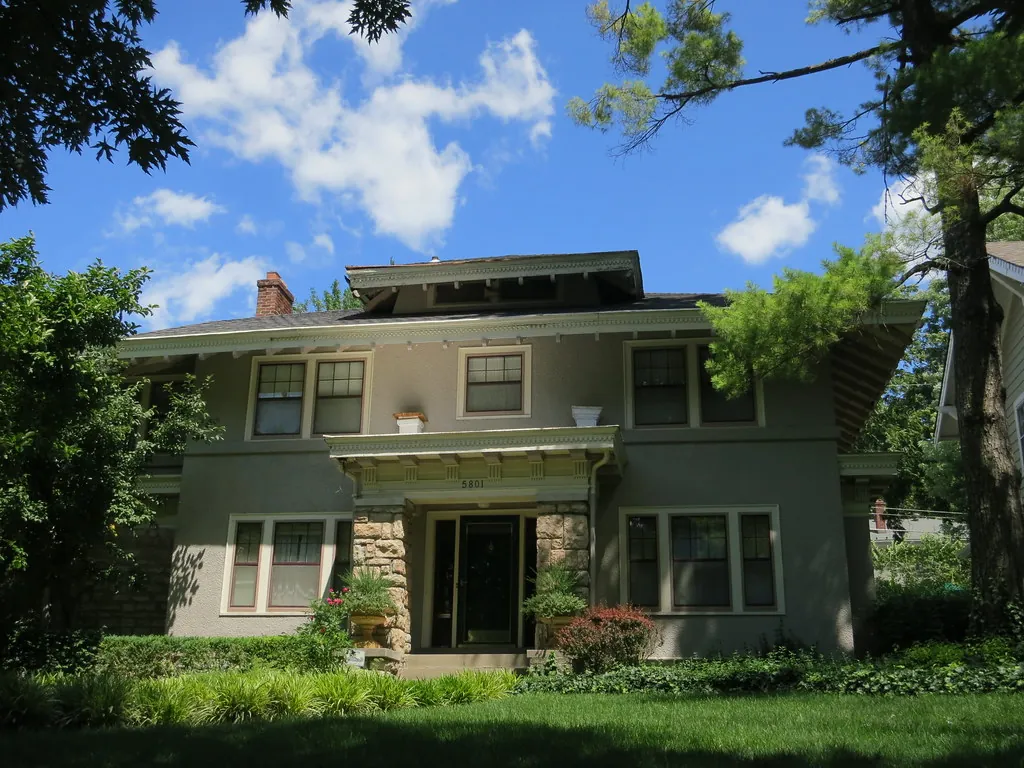 A two-story home on a tree-lined street in the Brookside neighborhood of Kansas City